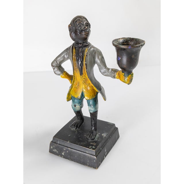 We are selling this 20th century Grand Tour style painted candle holder in the form of a Monkey Butler. This bronze is...