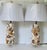 Gorgeous pair of richly encrusted with selected sea shells lamps on lucite bases. Sea shells lamp finials.