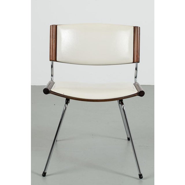 Badminton chair nd150 designed by designers nanna/jørgen ditzel in 1958. The chair has fake leather upholstery and a...