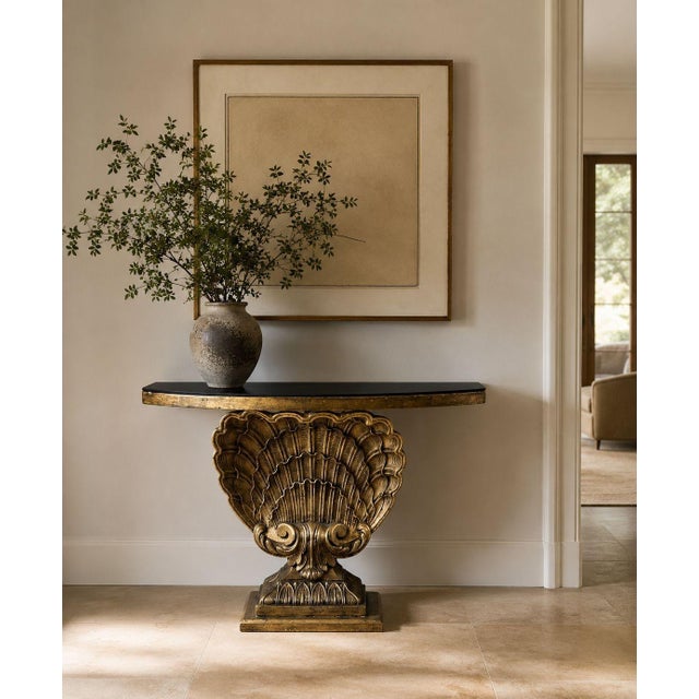 Grosfeld House Atrribution, Hollywood Regency, Shell Console, Silver Leaf, Black Glass, USA, 1970s A Hollywood Regency...