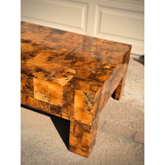 Sculptural Made Goods “Giulio” coffee table in richly figured patchwork tamarind wood, heavily inspired by the iconic...