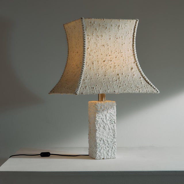Brutalist concrete table lamp from the 1980s. The lamp has an excitingly shaped textile lampshade to add to the effect....
