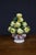 Large Italian ceramic fruit centerpiece featuring a piled arrangement of hand-modeled apples and leaves. The fruit is...