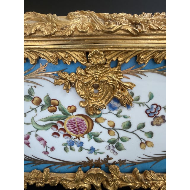 A 19th-century French porcelain and gilt-bronze casket. This work of art is crafted from Sèvres porcelain. The panels,...