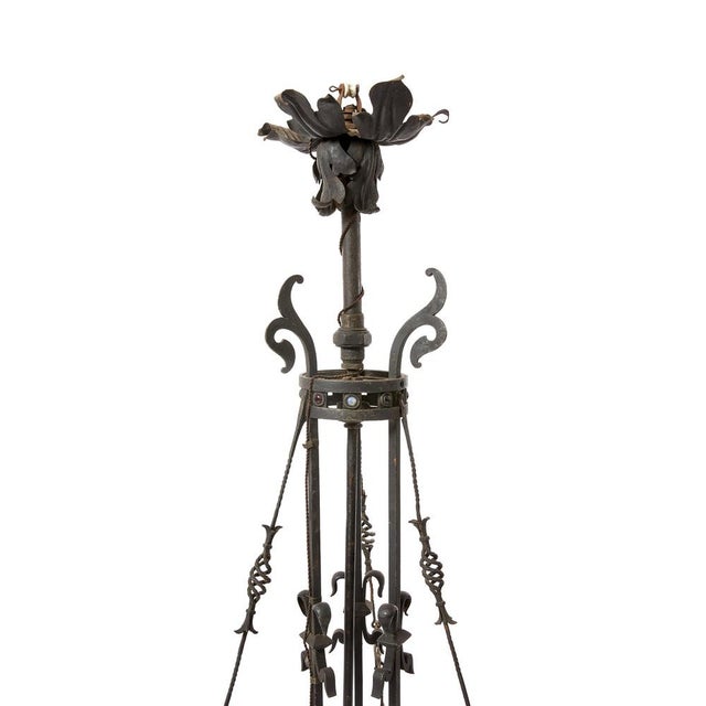 Wrought iron chandelier with handmade brass screws, ceramic fairlead, purple silk. It has handmade flower shape...