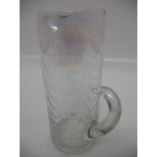 Elevate your barware collection with this vintage iridescent glass martini pitcher, a piece that exudes timeless charm and...