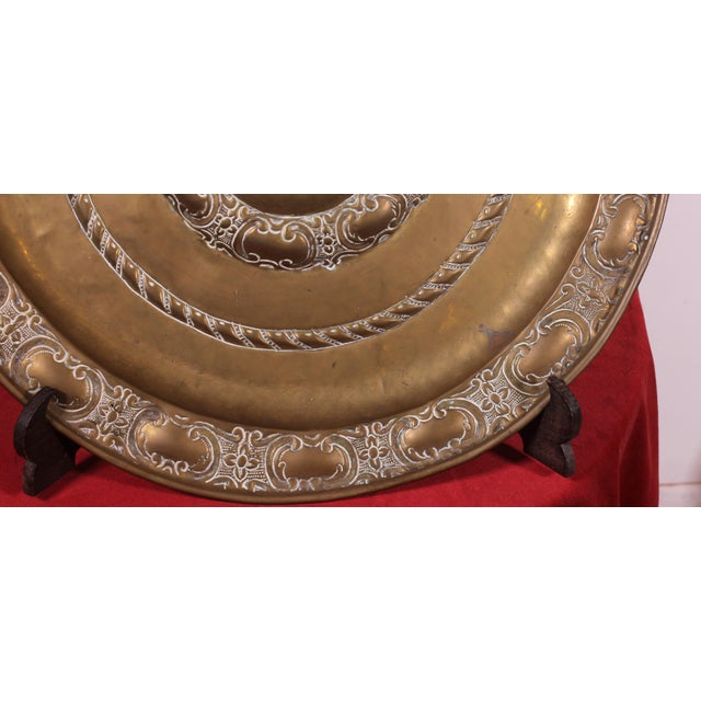Superb 18th-century French repoussé brass offering or alms dish. A very beautiful dish decorated with rosettes and...