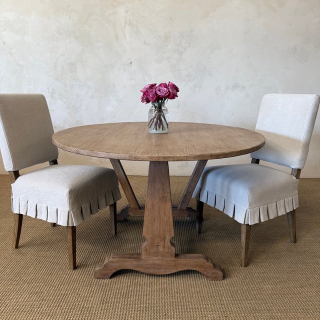 The Lyon Dining Table is crafted from solid pine and finished in a weathered natural finish, this oval dining table draws...