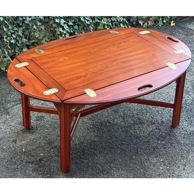 Beautifully crafted Henkel Harris coffee table featuring rich cherry wood with gorgeous grain patterns and a warm,...