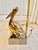 An incredible vintage modernist table lamp featuring a highly stylized brass pelican sculpture mounted on a polished...