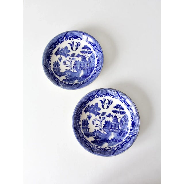 This is a pair of vintage Japanese blue willow ware bowls featuring the classic blue willow pattern. The transferware...