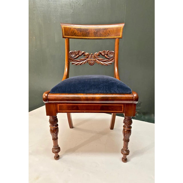 This is a superb example of a solid mahogany carved and inlaid Danish or Baltic side chair of Klismos form. The chair has...