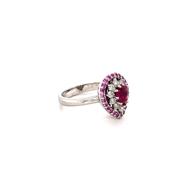 Roshe Jewels Ruby Ring with Pink Sapphire and Diamond White Gold Engagement Ring This ring has a Pear Cut Ruby that...