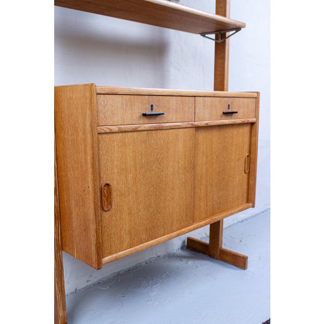 A beautiful vintage IKEA shelving unit in oak with an open, serene feel. The combination of shelving and integrated...