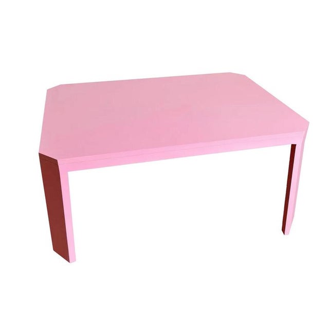 Dining Table in Pink Lacquered Wood. At first glance, it’s simple. But stay with it, and something shifts. The edges don’t...