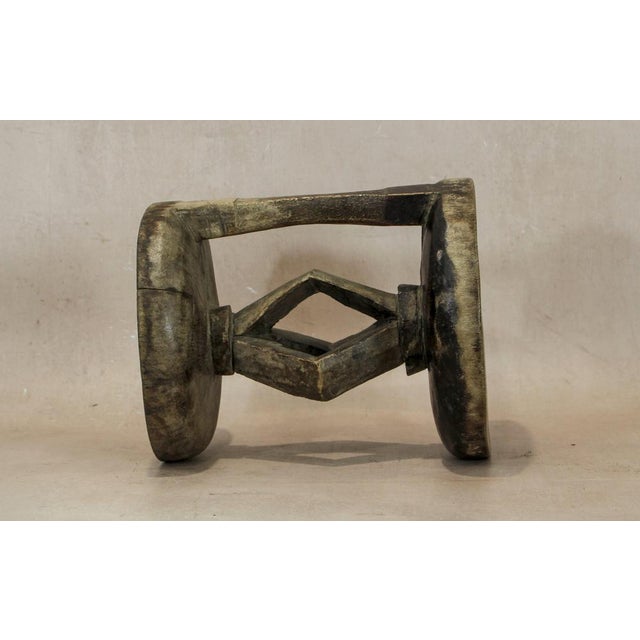 Hand-carved from a single piece of wood, the Tonga stool is a genuine artifact. These stools were status symbols for...