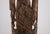An imposing Burmese wooden statue representing a sky deity. Burma, 18th century. The sculpture is presented on a steel...