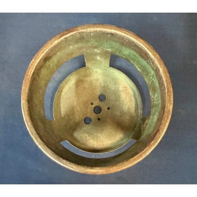 Tiffany Studios patinated brass sleeve/basket to hold a Tiffany Studios oil can. 4” tall X 5” diameter