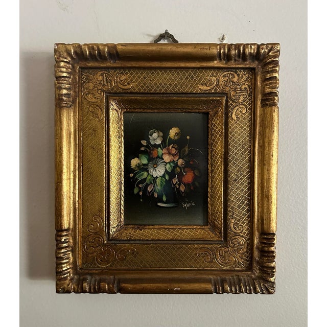 Vintage miniature Italian oil painting on panel of a floral still life in gold frame. Signed to the lower right corner.