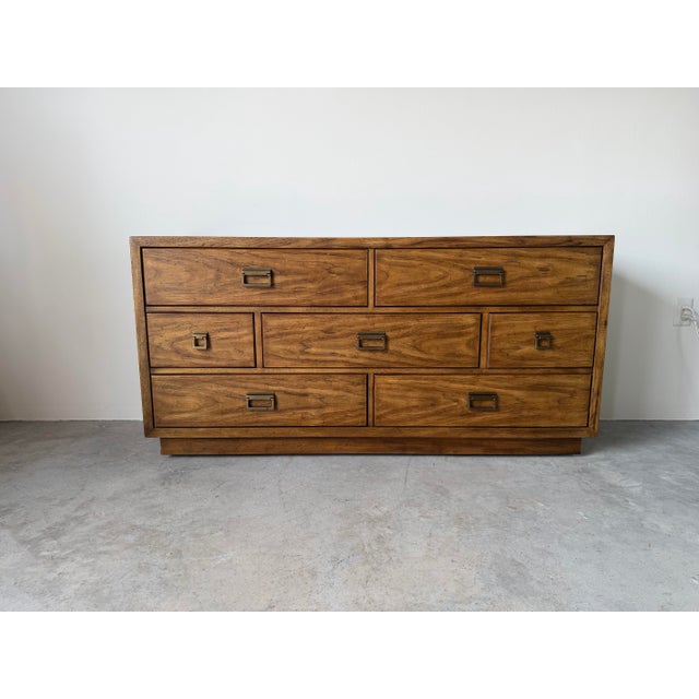 Handsome 1970s Mid-Century Modern dresser by Drexel, crafted in solid pecan with beautiful natural grain patterns...
