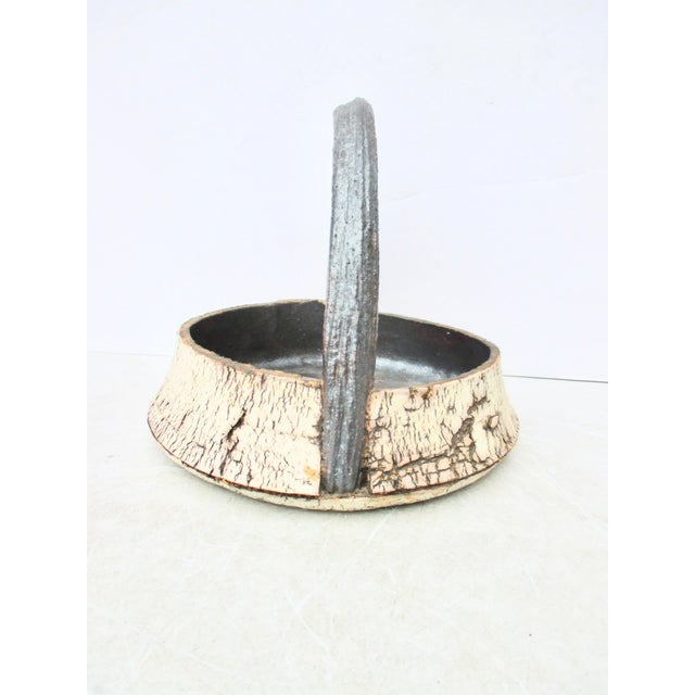 Peter Lane Stoneware ceramic basket with handle. (American born 1958) Beautifully made traditional basket shape with a...