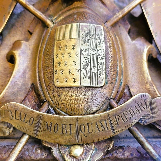 Pair of Louis XIV style bronze 3-light mirror sconces, decorated with the coat of arms of a noble family. The pediment is...