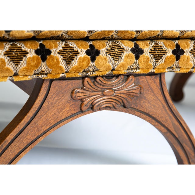 This chair is epic! Featuring a super cool scoop seat, tufted gold and dark brown plush custom upholstery, hardwood X-base...