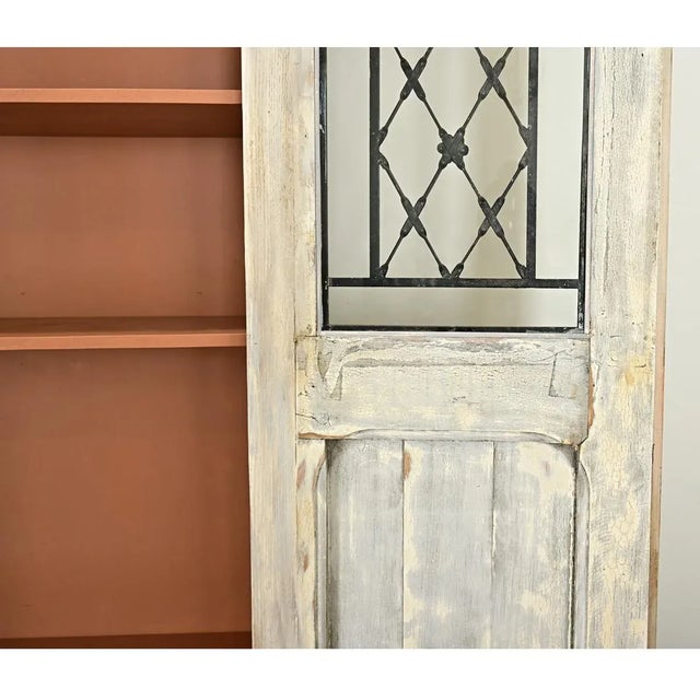 Dimensions: 94 ⅝” H x 48” W x 20” D This is a new, custom armoire (or bibliotheque) made by repurposing antique doors from...