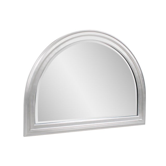 The George Mirror features a lacquer finish. The arched frame is made from wood and is accented with grooves for added...