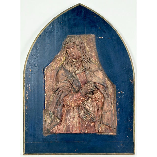 A high relief high relief sculpture of the Virgin Mary. The sculpture is part of what would have been a larger...