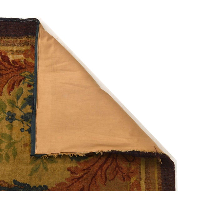 Handwoven in wool, this 6x9 antique French Aubusson rug, circa 1800-1900, exemplifies the elegance and refinement of...