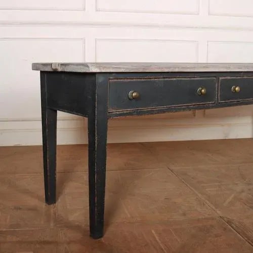 Wonderful English 18th C three drawer painted dresser base with a worn scrubbed top. 1840. This piece is designed in the...