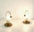 A pair of fun small lamps inteded to stand beside the bed made in brass and glass. Note that the etching on the glass is...