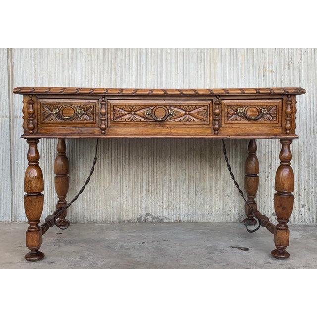 This elegant fruitwood desk was created in France, circa 1920. Made of blond walnut timber, the large writing table sits...