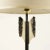 Pair of “Arrows” shaped base table lamps, black enamelled structure with brass details, ivory silk shades. Up to 250V...