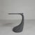 The elegant small table stands on a wide leg that tapers towards the top and transitions organically into a round top with...