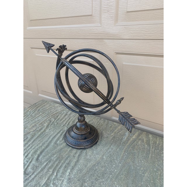 A beautifully crafted iron armillary sphere, evoking the timeless elegance of classical European gardens. Pieces like this...