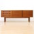 Designed and manufactured by A.H. McIntosh of Kirkcaldy, this elegant mid-century credenza showcases the refined...