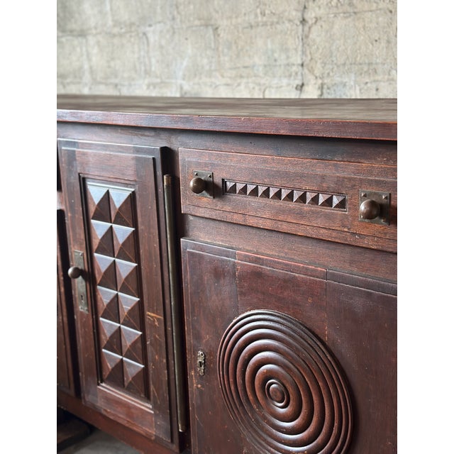 A brutalist period sideboard by Étienne Kohlmann, circa 1940. Full of character, made of solid oak, and finished in a...
