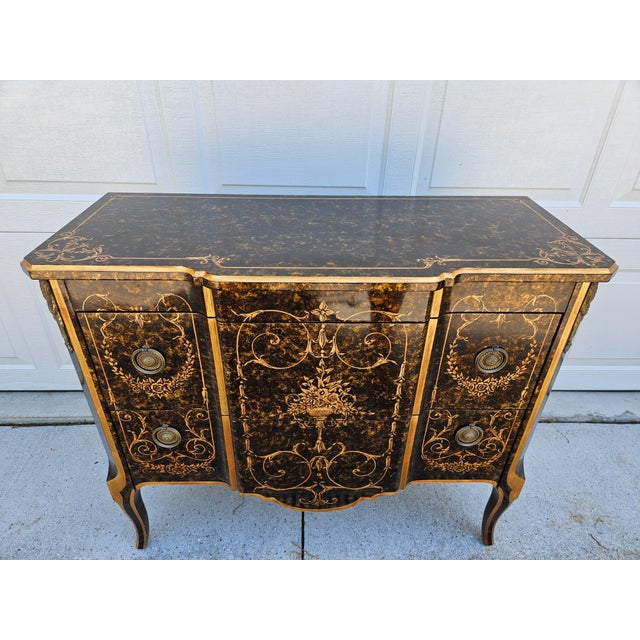A gorgeous Venetian style two drawer chest or commode by John Widdicomb. The golden stencil work stands out against the...