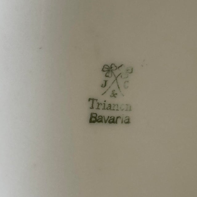 An antique porcelain, hand painted tureen in a beautiful Arts & Crafts, geometric floral pattern in a shade of purple/...