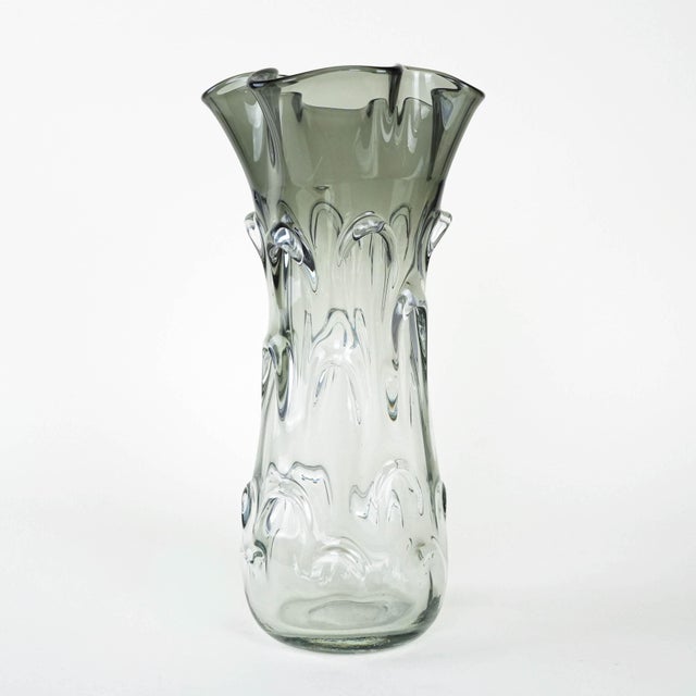 The vase was made in the 1960s in Italy. A unique vase made of artistic glass in a smoky grey shade. The organic form with...