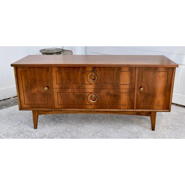 Vintage (1960's) Cedar Chest has an MCM Style. Made b y Lane Furniture. The Wood is Walnut. The Chest is on legs. 2 Keys....