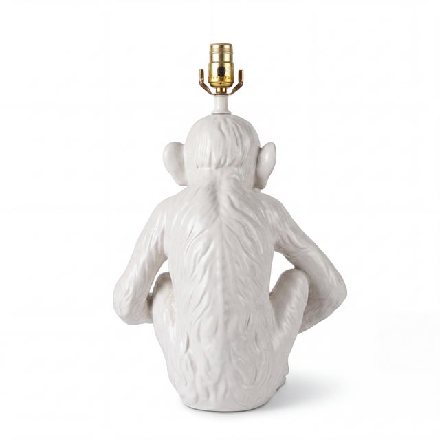This is a 1970s Blanc de Chine style Italian ceramic monkey form lamp in very good condition. It is in working order.