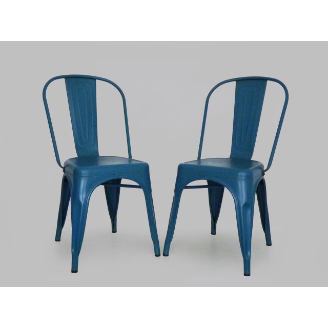 Pair of tolix a chairs in blue metal by xavier pauchard after registering the tolix brand in 1927, xavier pauchard decided...