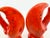 A charming pair of vintage ceramic salt and pepper shakers designed as oversized lobster claws, finished in vivid coral...