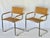 A pair of chrome chairs with leather seats and backs. The tubular cantilever design attributed to Mart Stam. Retains a...