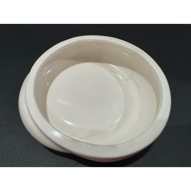 Tiffany & Co. white porcelain sleeping cat trinket box from the late 1970s series. The cat is modeled in a curled resting...