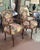 Find an elegant pair of French vintage parlor chairs with tapestry upholstery. Each features Louis the 15th frames in...