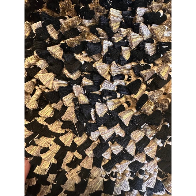 Elegant Kenneth Meyer tassel fringe trim in a sophisticated black, champagne, and ivory palette with subtle metallic...